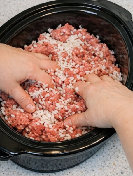 Mix raw white rice into raw ground beef, along with 3 other ingredients, into slow cooker for a hearty meal that’s my default when I don’t know what