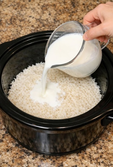 Pour whole milk over raw white rice, alongside 3 extra ingredients, into slow cooker for a nostalgic treat that disappears faster than anything else