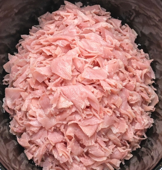 Toss a pile of shaved deli ham in the slow cooker with 3 other ingredients and get a meal so delicious your family will be begging for more.