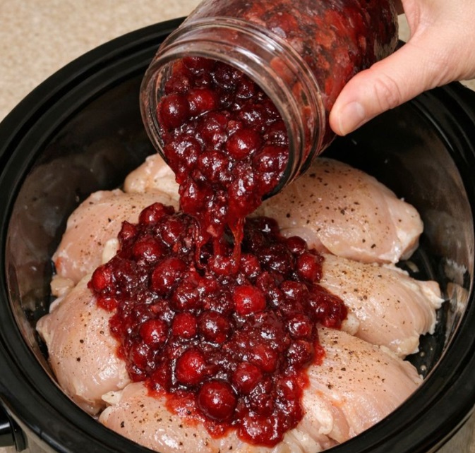 Dump whole cranberry sauce over raw chicken breasts, accompanied by 2 ingredients, into slow cooker for a comforting dinner that’s the one everyone asks for
